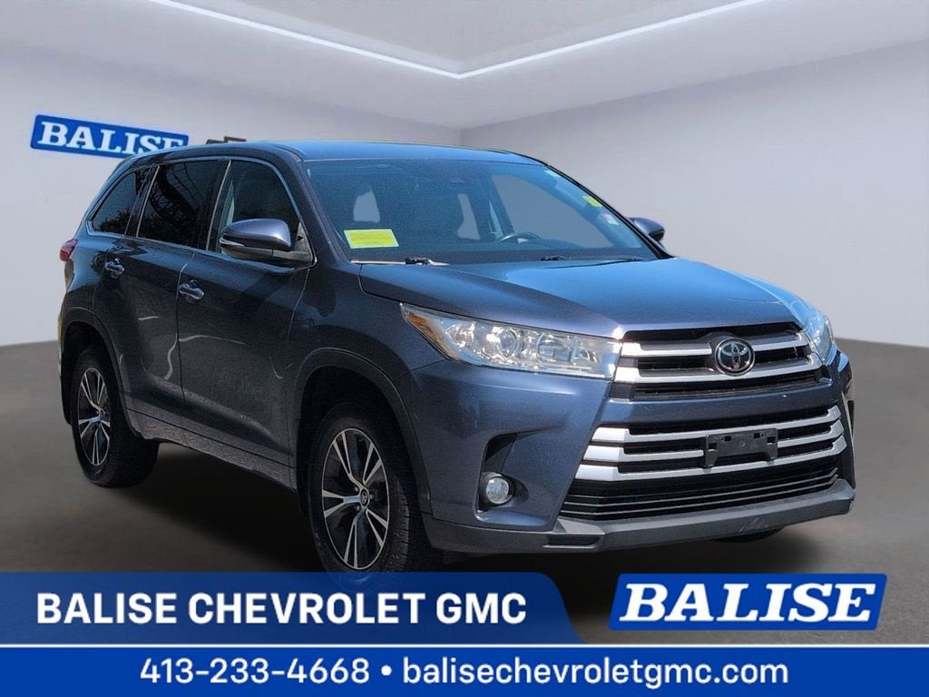 2017 Toyota Highlander LE Plus in Blue — front three-quarter view